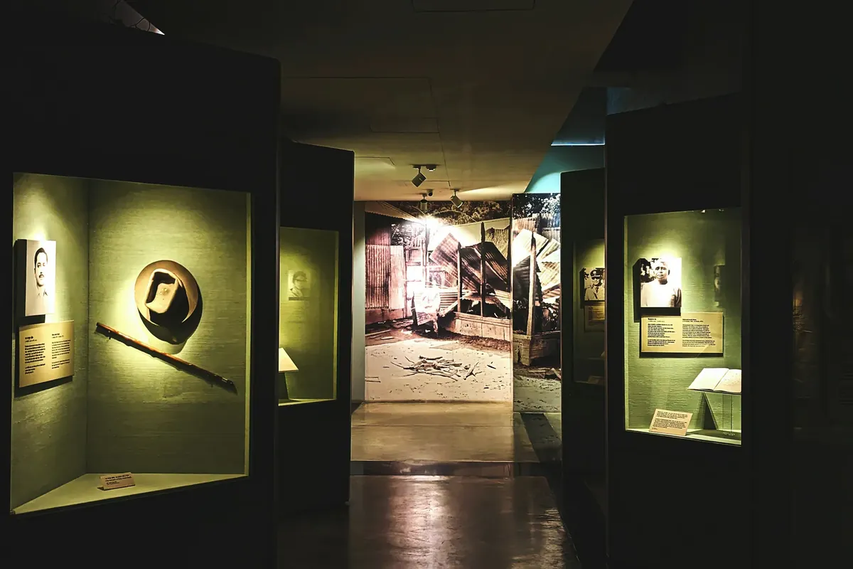 A dimly lit hallway with an illuminated display case
