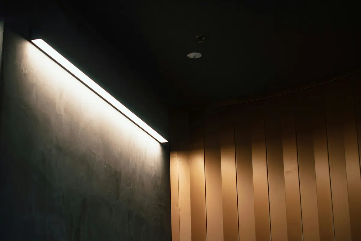 A white ceiling detail with concealed light